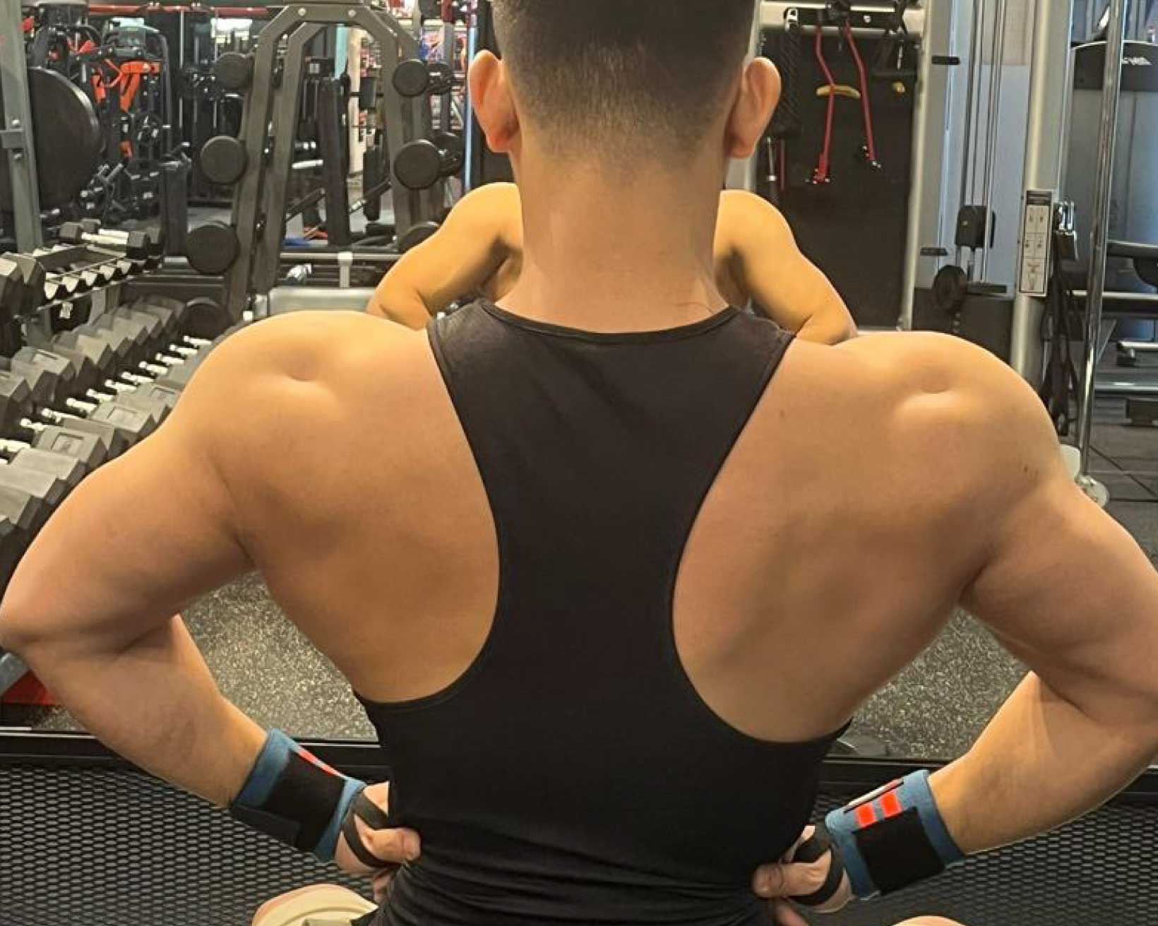 Body building muscle young man showing his back